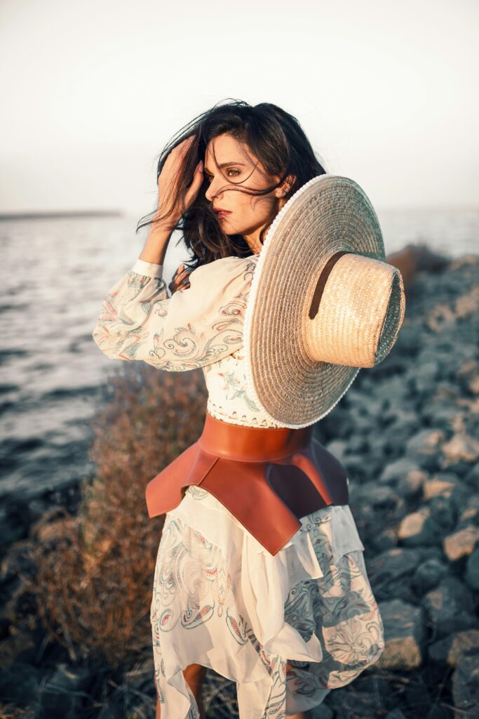 girl with flowy dress in the beach